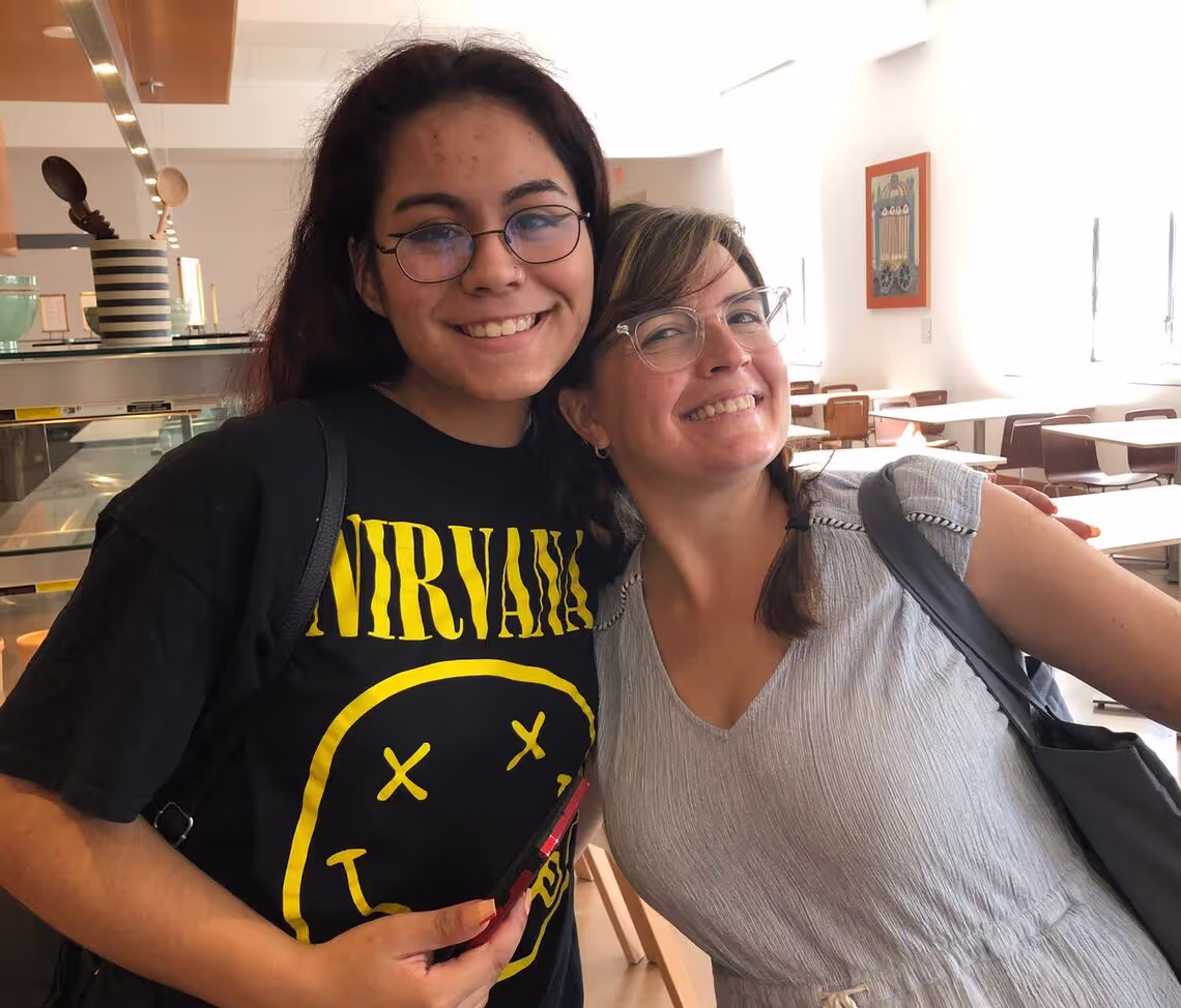 A couple of women standing next to each other